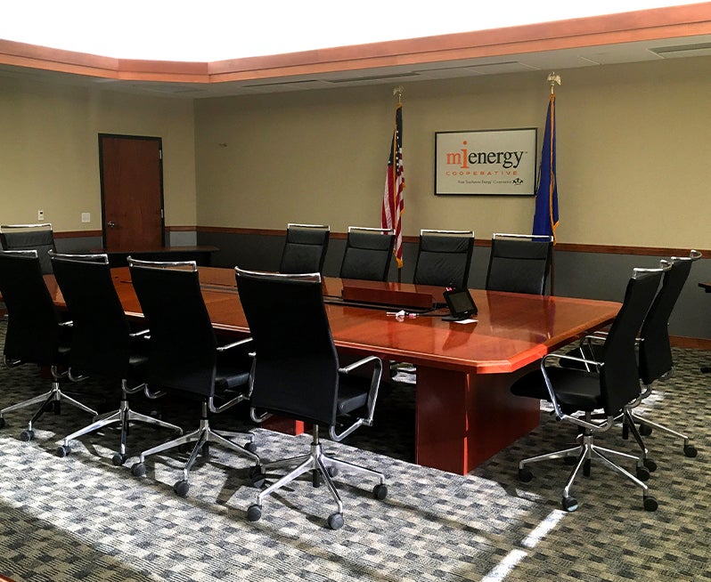 photo of board table with chairs surrounding